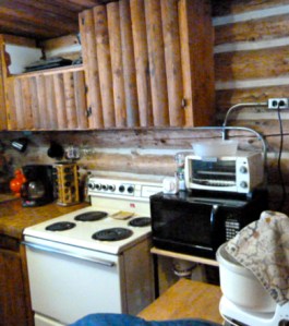 A "before we bought the place" shot of the kitchen; the cupboards are now history.
